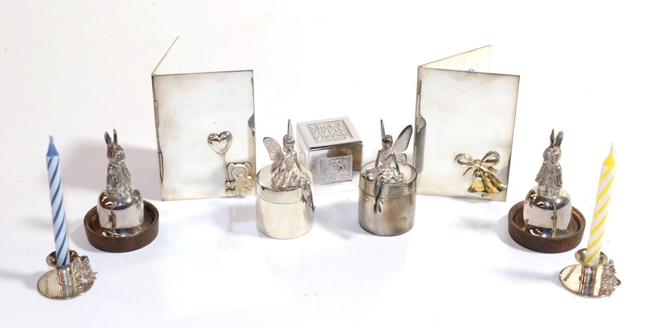Lot 288 - A quantity of children's silver, comprising: two pairs of tooth boxes, one pair with cast...