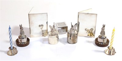 Lot 288 - A quantity of children's silver, comprising: two pairs of tooth boxes, one pair with cast...