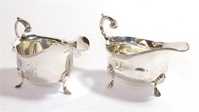 Lot 302 - An Edward VII and a George V silver sauce boat, the first by Horace Woodward and Co. Ltd.,...