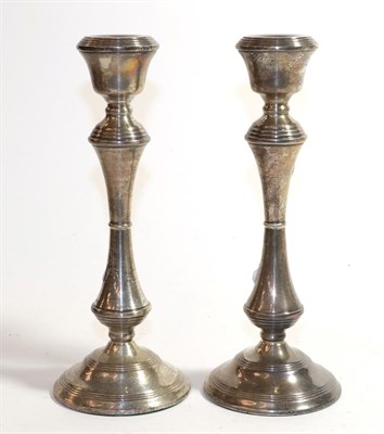 Lot 303 - A pair of Elizabeth II silver candlesticks, by Broadway and Co., Birmingham, 1978, each on circular