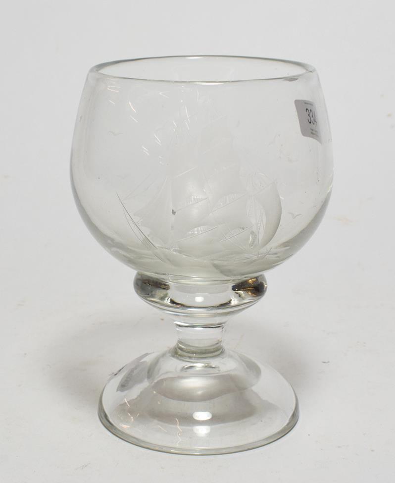 Lot 334 - A 19th century etched glass pedestal cup, decorated with a triple masted ship amongst the waves