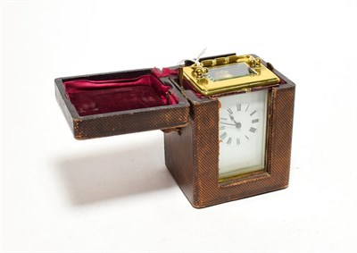 Lot 335 - A brass timepiece in carrying case