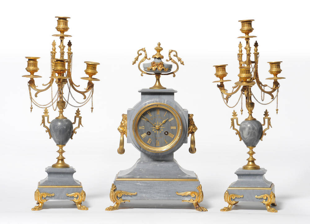 Lot 1037 - A French Grey Marble and Gilt Metal Striking Mantel Clock with Garniture, retailed by C Douard...