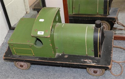 Lot 366 - An early 20th century green painted wooden model of a locomotive, 75cm long