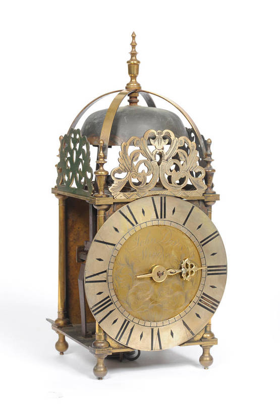 Lot 1047 - A Brass Striking Lantern Clock, the case with pierced frets, turned brass finials, 6-1/2-inch...