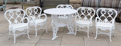 Lot 1105 - A white painted cast iron circular garden table; together with a set of five similar chairs