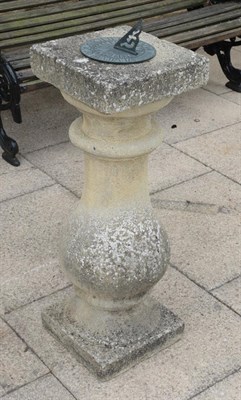 Lot 1106 - A weathered composition baluster sundial