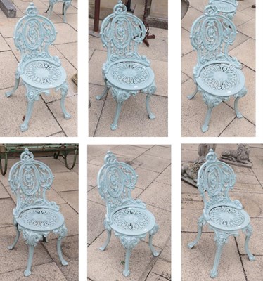 Lot 1115 - A set of four Victorian cast iron garden chairs, the cartouche shaped backs with foliate...