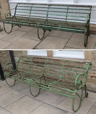 Lot 1117 - A pair of Regency green painted scroll arm cast metal garden benches