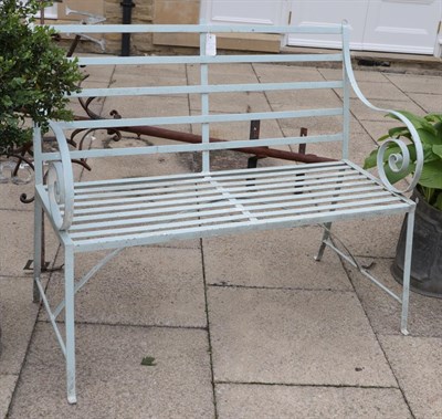Lot 1122 - An early 20th century painted metal garden bench   Provenance: Formerly of Lonsdale Hall,...