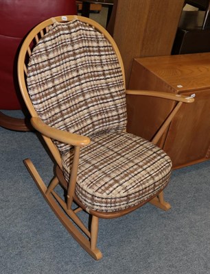 Lot 1137 - An Ercol light elm rocking chair