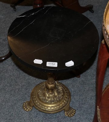 Lot 1152 - A small circular marble topped occasional table with brass base and paw feet, 44cm by 36cm
