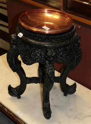 Lot 1154 - A Burmese blackwood plant stand with associated liner