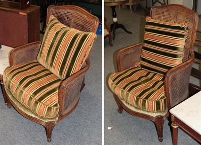 Lot 1155 - A three piece double cane bergere suite, comprising sofa and two chairs