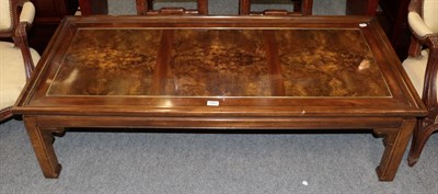 Lot 1161 - A modern coffee table in a Chinese style, 39cm by 137cm by 61cm