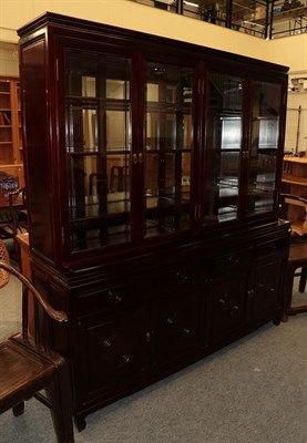 Lot 1166 - A Chinese six foot hardwood glazed display cabinet, 198cm by 183cm by 48cm (en suite with...