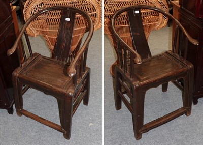 Lot 1167 - A pair of Chinese hardwood open armchairs