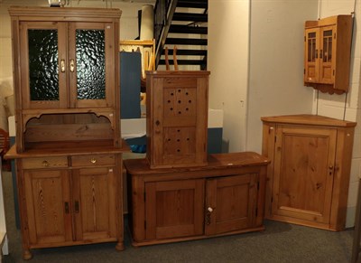 Lot 1175 - A small group of pine furniture comprising a two door low cabinet, 67cm high by 128cm ; another...