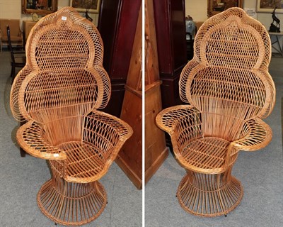 Lot 1180 - A pair of ornate cane peacock chairs