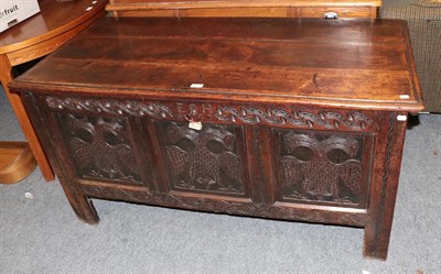 Lot 1189 - A 17th century oak three panel coffer, the frieze carved (E H 1692) the three front panels each...