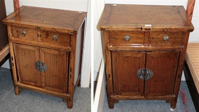 Lot 1198 - A pair of 20th century Chinese bedside cupboards, each 77cm by 59cm by 36cm