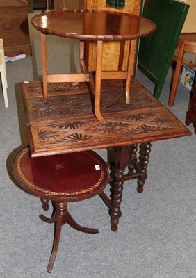 Lot 1200 - A carved oak table, a gilt mirror and two reproduction tables