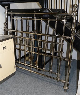 Lot 1202 - A double bedstead with Nickel finish