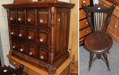 Lot 1206 - An adjustable piano seat, together with a reproduction chest of drawers