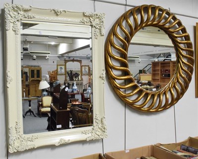 Lot 1213 - A white painted carved mirror; together with a gilt reticulated circular mirror