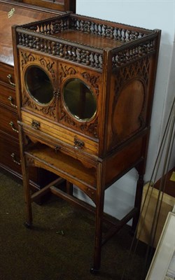 Lot 1216 - A late Victorian/Edwardian walnut side cabinet, with pierced and baluster turned gallery above...