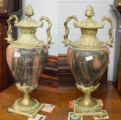 Lot 1229 - A pair of marble and gilt metal twin handled baluster form urns, in the classical taste each...