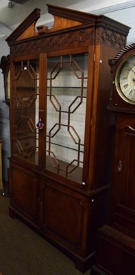 Lot 1236 - A Chippendale style mahogany bookcase, 240cm by 135cm by 43cm