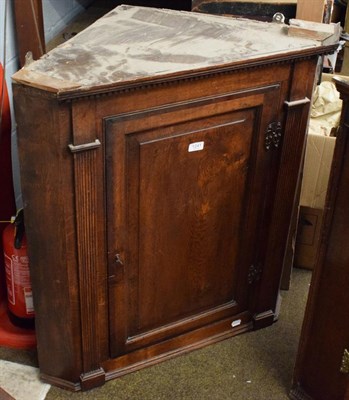 Lot 1241 - A George the III panel work hanging corner cupboard, 93cm by 82 by 47cm