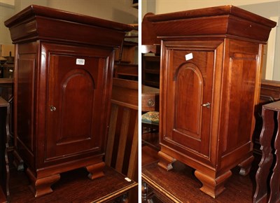 Lot 1252 - A pair of reproduction bedside cupboards, 69cm by 45cm by 34cm each