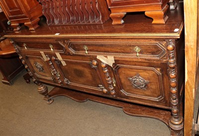 Lot 1253 - An early 20th century carved oak mirror backed sideboard, 160cm by 170cm by 61cm