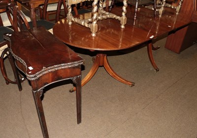 Lot 1261 - An early 20th century mahogany twin pedestal dining table with one additional leaf, 208cm fully...