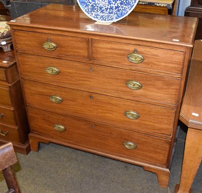 Lot 1289 - A George III mahogany straight front chest of drawers, two short over three long on bracket...