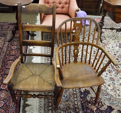 Lot 1334 - A 19th century yew and elm Windsor armchair and a rush seated low chair of similar taste