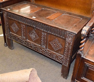 Lot 1347 - An 18th century carved oak three panel coffer