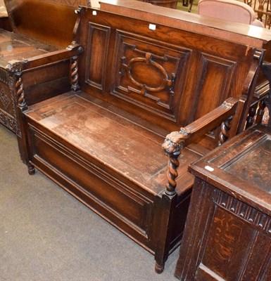 Lot 1348 - A carved oak monks bench