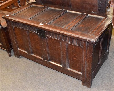 Lot 1349 - An 18th century four-panel oak coffer, 117cm by 55cm by 62cm high