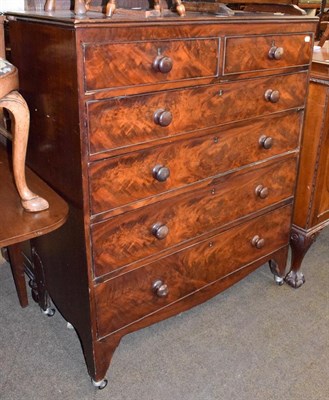 Lot 1353 - A George III mahogany five height straight front chest of drawers, with later turned wooden handles