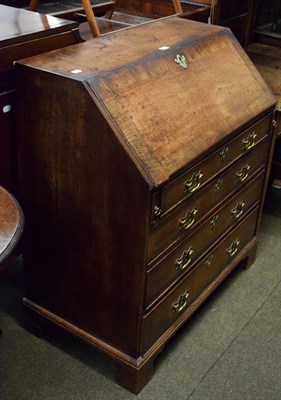 Lot 1360 - A George III cross banded mahogany bureau