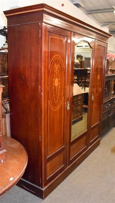 Lot 1365 - An Edwardian inlaid mahogany mirrored double wardrobe