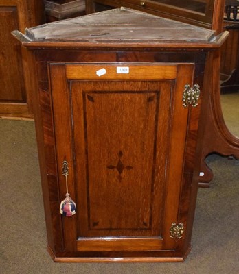 Lot 1369 - A George III mahogany and oak hanging corner cupboard