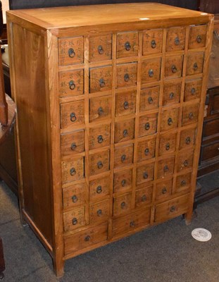 Lot 1370 - A 20th century Chinese cabinet, fitted with 42 small square drawers decorated with calligraphy over