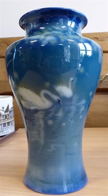Lot 2005 - A Royal Worcester Sabrina Ware Vase, by James Southall, painted with swans on a blue ground,...