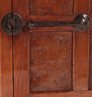 Lot 2045 - Robert Mouseman Thompson (1876-1955): An English Burr Oak Panelled Hanging Corner Cupboard, 1930's