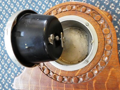 Lot 2047 - Robert Mouseman Thompson (1876-1955): An English Oak Mantel Clock, 1930's, the circular case...