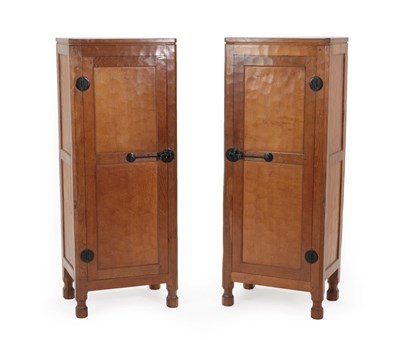 Lot 2048 - Robert Mouseman Thompson (1876-1955): A Pair of English Oak Tall Panelled Cupboards,...